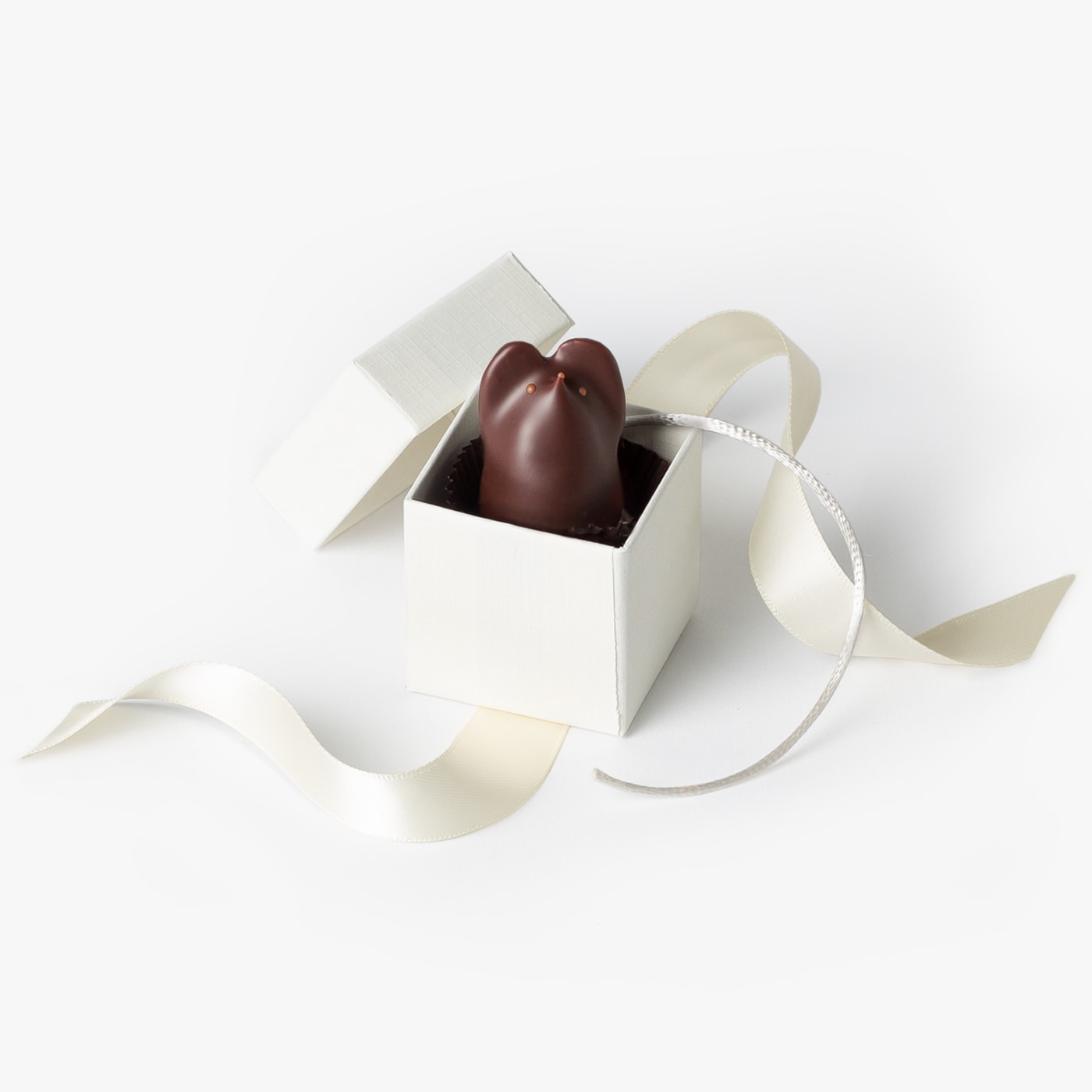 Single dark chocolate mouse packaged in a gift box, ready for your next wedding or event.